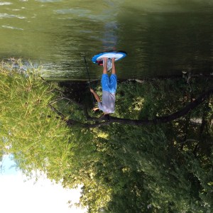 kayaker in water with nature