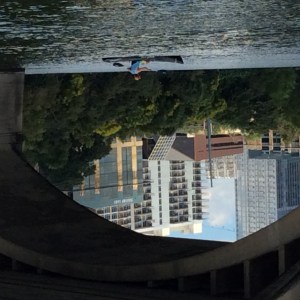 kayaker under congress bridge in austin tx