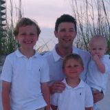 a boy and girl posing for a photo